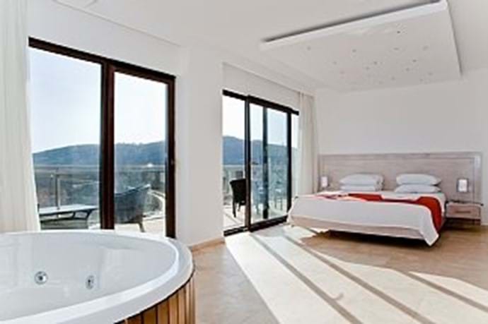 The master bedroom has its own jacuzzi